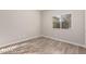 Simple bedroom with wood-look flooring and a window with blinds at 8809 Early Horizon Dr, Las Vegas, NV 89178