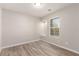 Bedroom with wood-look floors, window seat, and neutral walls at 8809 Early Horizon Dr, Las Vegas, NV 89178