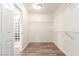 Spacious walk-in closet with wire shelving and wood-look floors at 8809 Early Horizon Dr, Las Vegas, NV 89178