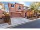 Two-story house with a two-car garage and driveway at 8809 Early Horizon Dr, Las Vegas, NV 89178