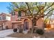 Two-story house with a two-car garage, landscaping, and walkway at 8809 Early Horizon Dr, Las Vegas, NV 89178