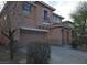 Tan two-story house with a two-car garage at 8809 Early Horizon Dr, Las Vegas, NV 89178