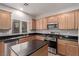 Modern kitchen with stainless steel appliances and an island at 8809 Early Horizon Dr, Las Vegas, NV 89178