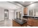 Open concept kitchen with island and view into dining area at 8809 Early Horizon Dr, Las Vegas, NV 89178