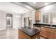 Modern kitchen with island, stainless steel appliances, and ample cabinet space at 8809 Early Horizon Dr, Las Vegas, NV 89178