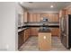 Modern kitchen with stainless steel appliances and an island at 8809 Early Horizon Dr, Las Vegas, NV 89178