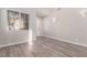 Bright living room with high ceilings and grey wood-look floors at 8809 Early Horizon Dr, Las Vegas, NV 89178