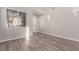 Spacious living room with gray vinyl flooring and large window at 8809 Early Horizon Dr, Las Vegas, NV 89178