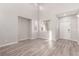 Bright living room with high ceilings and grey wood-look floors at 8809 Early Horizon Dr, Las Vegas, NV 89178