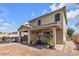 Backyard patio with seating area, covered patio, and mature plants at 8862 Nannette Marie Ct, Las Vegas, NV 89148