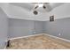 Spacious bedroom with tile floors and ceiling fan at 8862 Nannette Marie Ct, Las Vegas, NV 89148