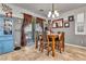 Bright dining room features a wood table with six chairs and access to the backyard at 8862 Nannette Marie Ct, Las Vegas, NV 89148