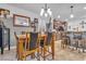 Open concept dining room with kitchen views, seating for six at 8862 Nannette Marie Ct, Las Vegas, NV 89148