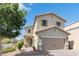 Two-story house with neutral-color exterior, attached garage, and landscaping at 8862 Nannette Marie Ct, Las Vegas, NV 89148