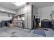 Organized garage with storage cabinets and flooring at 8862 Nannette Marie Ct, Las Vegas, NV 89148