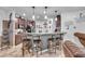 Modern kitchen with a breakfast bar, ample cabinetry, and granite countertops at 8862 Nannette Marie Ct, Las Vegas, NV 89148