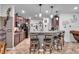 Spacious kitchen with dark cabinetry, granite counters, and island with seating at 8862 Nannette Marie Ct, Las Vegas, NV 89148