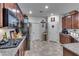 Well-equipped kitchen featuring dark wood cabinets and stainless steel appliances at 8862 Nannette Marie Ct, Las Vegas, NV 89148