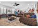 Comfortable living room with leather furniture, a large sectional sofa, and a coffee table at 8862 Nannette Marie Ct, Las Vegas, NV 89148