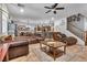 Open living room with comfortable seating and a view into the kitchen area at 8862 Nannette Marie Ct, Las Vegas, NV 89148