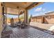 Covered patio with seating area and view of sheds at 8862 Nannette Marie Ct, Las Vegas, NV 89148