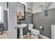 Stylish powder room with pedestal sink and gray walls at 8862 Nannette Marie Ct, Las Vegas, NV 89148