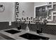 Double vanity bathroom with dark gray cabinets and hexagon tile at 9000 S Las Vegas Blvd # 2222, Las Vegas, NV 89123