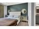 Elegant bedroom featuring a tufted headboard and stylish mirrors at 9000 Las Vegas Blvd # 2222, Las Vegas, NV 89123