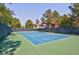 Well-maintained tennis court with green surroundings at 9000 S Las Vegas Blvd # 2222, Las Vegas, NV 89123