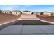 Landscaped backyard with artificial turf and rock at 9202 Valley Betica Ave, Las Vegas, NV 89148