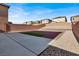 Backyard space featuring stone landscaping, block walls and new home construction at 9202 Valley Betica Ave, Las Vegas, NV 89148