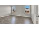 Bright bedroom with gray walls and wood-look flooring at 9202 Valley Betica Ave, Las Vegas, NV 89148