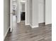 Hallway with wood-look floors and access to bathroom at 9202 Valley Betica Ave, Las Vegas, NV 89148