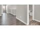 Clean hallway with wood-look floors and access to bathroom at 9202 Valley Betica Ave, Las Vegas, NV 89148