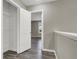 Hallway view into a bedroom and walk-in closet, showcasing a functional layout with neutral walls and flooring at 9202 Valley Betica Ave, Las Vegas, NV 89148