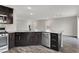 Kitchen island with granite countertop and stainless steel dishwasher at 9202 Valley Betica Ave, Las Vegas, NV 89148