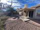 Covered patio and gravel backyard with desert landscaping at , Henderson, NV 89014