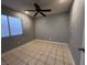 Bedroom with ceiling fan and large window at , Henderson, NV 89014