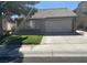 Single-story home with attached garage and well-maintained lawn at , Henderson, NV 89014