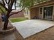 Private backyard with a covered patio and artificial turf at 10046 Dancing Lasso Ct, Las Vegas, NV 89178