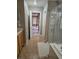 Well-lit bathroom with tiled floors and a shower at 10046 Dancing Lasso Ct, Las Vegas, NV 89178