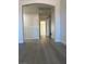 Open hallway with white railings and trim, showcasing clean lines and access to multiple rooms at 10046 Dancing Lasso Ct, Las Vegas, NV 89178