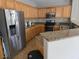 Kitchen boasts granite countertops and wood cabinets at 10046 Dancing Lasso Ct, Las Vegas, NV 89178