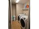 Laundry room with washer, dryer, and shelving at 10046 Dancing Lasso Ct, Las Vegas, NV 89178