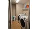 Convenient laundry room with modern washer and dryer, streamlining household chores at 10046 Dancing Lasso Ct, Las Vegas, NV 89178