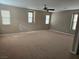 Large main bedroom with carpeted floors and multiple windows at 10046 Dancing Lasso Ct, Las Vegas, NV 89178