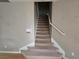 Carpeted staircase leading to the upper level at 10046 Dancing Lasso Ct, Las Vegas, NV 89178