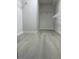 Spacious walk-in closet offers ample storage with built-in shelving and modern gray flooring at 10046 Dancing Lasso Ct, Las Vegas, NV 89178