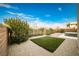 Landscaped backyard with artificial turf and gravel at 10226 Jade Gardens Dr, Las Vegas, NV 89135