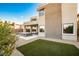 Modern backyard with spa, artificial turf, and mountain views at 10226 Jade Gardens Dr, Las Vegas, NV 89135